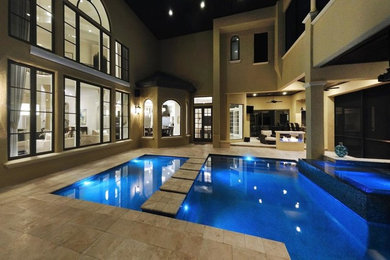 Photo of a large modern backyard custom-shaped lap pool in San Diego with a hot tub and tile.