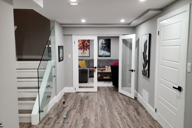 Example of an eclectic basement design in Toronto