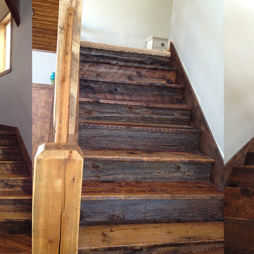 Reclaimed Wood Stair Treads, Railing, and Flooring in Rustic Entryway