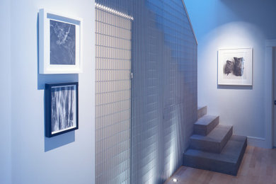 Example of a mid-sized minimalist concrete metal railing staircase design in San Francisco with concrete risers