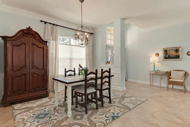 Inspiration for a shabby-chic style porcelain tile dining room remodel in Jacksonville with blue walls
