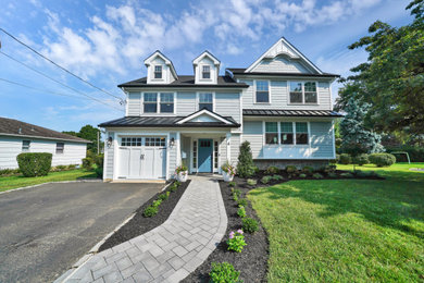 Inspiration for a transitional two-story house exterior remodel in New York with a shingle roof