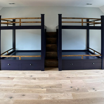 Spacious Shared Kids Room with Custom Bunk Beds, Integrated Drawers, and Vaulted