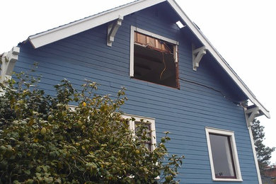 Inspiration for a large country two-story house exterior remodel in Seattle