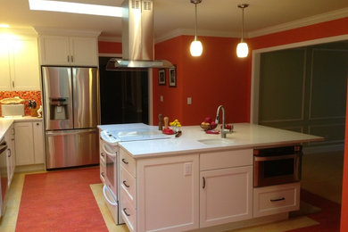 Inspiration for a contemporary l-shaped linoleum floor and beige floor eat-in kitchen remodel in Seattle with a double-bowl sink, shaker cabinets, beige cabinets, quartz countertops, red backsplash, mosaic tile backsplash, stainless steel appliances and an island