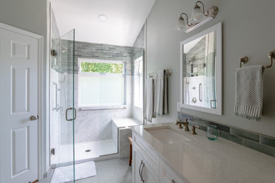 Bathroom - large transitional master white tile and porcelain tile porcelain tile, gray floor and double-sink bathroom idea in Portland with recessed-panel cabinets, white cabinets, quartz countertops, a hinged shower door, white countertops and a built-in vanity