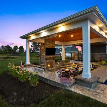 Pavilion with outdoor kitchen, gas fireplace and swim up bar.