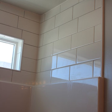 Tile above  shower enclosure