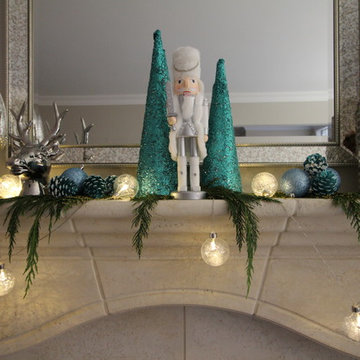 Silver and white nutcracker flanked by Tiffany blue trees
