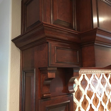 Heavy, intricate detailing on this custom cherry hood
