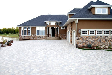 Inspiration for an expansive traditional garden in Other with concrete pavers.