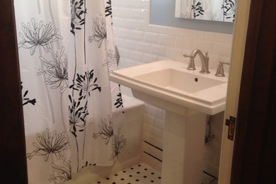 Example of a small arts and crafts master white tile and subway tile ceramic tile bathroom design in Chicago with blue walls and a pedestal sink