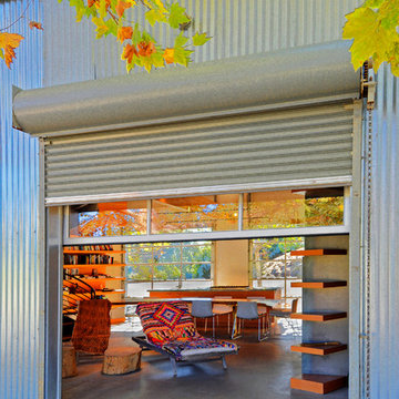 Detail of exterior solid and interior glass roll up doors
