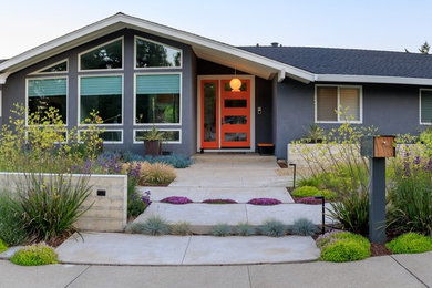 This is an example of a large contemporary drought-tolerant and full sun front yard concrete paver retaining wall landscape in San Francisco for summer.
