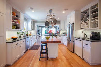 Arts and crafts kitchen in Seattle with stainless steel appliances and wood benchtops.
