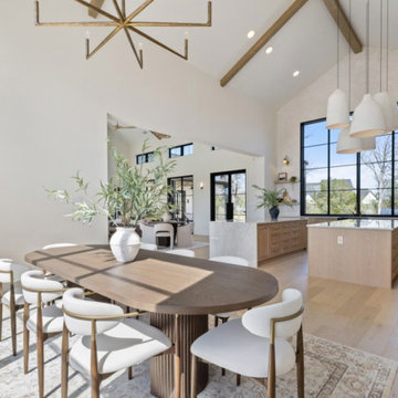 Dining and Kitchen Overlook with Soaring Ceilings and Natural Light