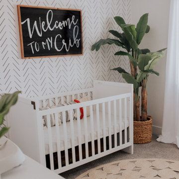 Baby Boy's Nursery With Herringbone Wallpaper