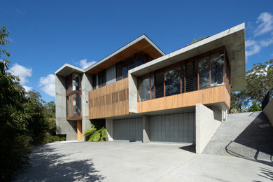 This is an example of a large contemporary home design in Gold Coast - Tweed.