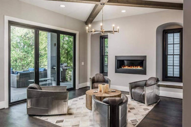 Photo of a large country open concept family room in Berlin with grey walls, dark hardwood floors, a ribbon fireplace and brown floor.