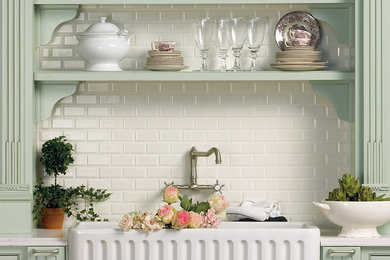 Kitchen - mid-sized traditional kitchen idea in Miami with a farmhouse sink, raised-panel cabinets, green cabinets, white backsplash, ceramic backsplash and marble countertops