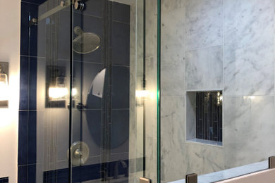Large trendy master sliding shower door photo in Seattle