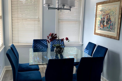 Mid-sized trendy vinyl floor and gray floor breakfast nook photo in Chicago with blue walls