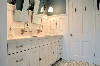 Inspiration for a mid-sized timeless kids' white tile and subway tile marble floor alcove bathtub remodel in New York with shaker cabinets, white cabinets, marble countertops, a two-piece toilet and blue walls