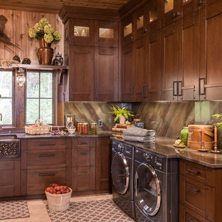 Inspiration for a large traditional l-shaped separated utility room in Other with a belfast sink, beige floors, recessed-panel cabinets, onyx worktops, beige walls, porcelain flooring, a side by side washer and dryer, brown worktops and dark wood cabinets.