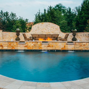 Straight line pool and spa with slide and outdoor kitchen