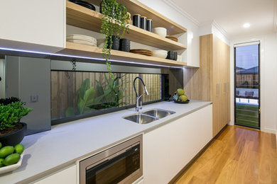 Photo of a beach style kitchen in Brisbane.