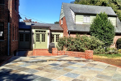 Design ideas for a large traditional one-storey brick green exterior in Richmond.