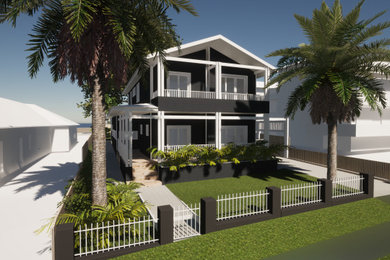 Mid-sized beach style two-storey house exterior in Sydney with a metal roof and a grey roof.
