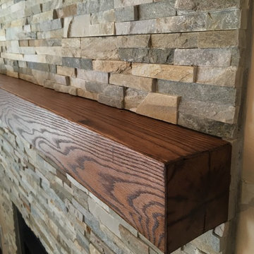 Ben's stacked stone fireplace with reclaimed wood mantle