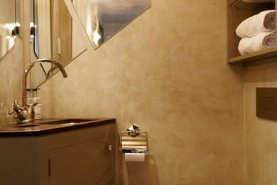 This is an example of a transitional powder room in Copenhagen.