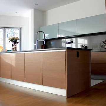 Glass and veneer kitchen in South Calgary
