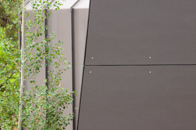 Inspiration for a large modern one-story mixed siding exterior home remodel in Albuquerque