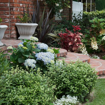 Brick entry with colorful plant complement