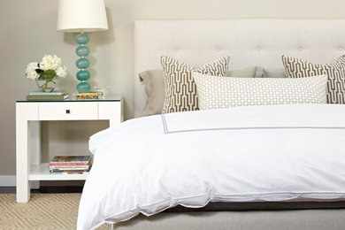 Example of a mid-sized trendy guest carpeted bedroom design in Austin with beige walls and no fireplace