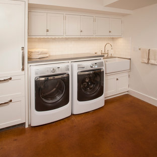 This is an example of a medium sized traditional u-shaped separated utility room in Seattle with a belfast sink, shaker cabinets, white cabinets, zinc worktops, white walls, concrete flooring and a side by side washer and dryer.