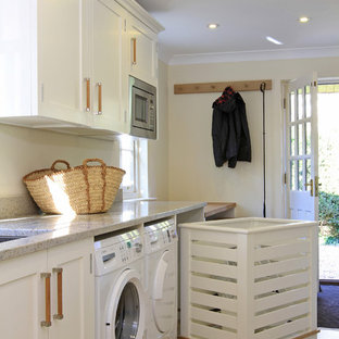 Design ideas for a classic utility room in Hampshire with white cabinets.