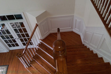 Elegant wooden l-shaped staircase photo in DC Metro with wooden risers