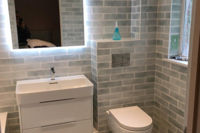 Medium sized contemporary family bathroom in London with ceramic flooring, grey floors and a built in vanity unit.