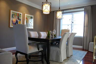 Mid-sized transitional medium tone wood floor and brown floor enclosed dining room photo in Philadelphia with gray walls and no fireplace
