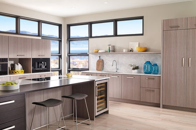 Inspiration for a modern eat-in kitchen in Indianapolis with stainless steel appliances and with island.