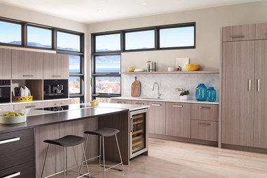 Eat-in kitchen - modern eat-in kitchen idea in Indianapolis with stainless steel appliances and an island