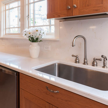 Custom, in-cabinet dish drying rack. Water drips directly into the sink.