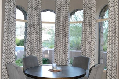Example of a mid-sized transitional ceramic tile kitchen/dining room combo design in Phoenix with gray walls and no fireplace