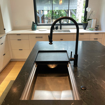 Striking 42" handcrafted stainless steel sink and black soapstone counters
