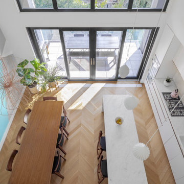 Williamsburg Townhouse - Mezzanine View down to Kitchen/Dining Space and Deck