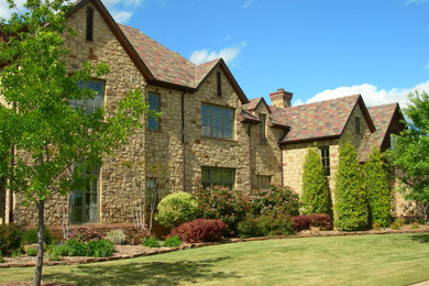 Inspiration for a victorian two-story mixed siding exterior home remodel in Dallas